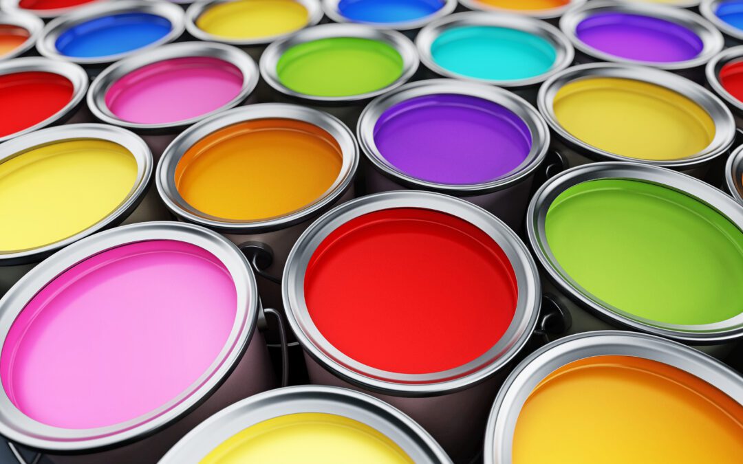 numerous cans of different colored paint, which can be measured using ASTM standards